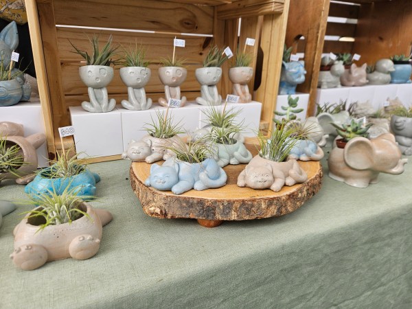 concrete planters in the shape of cats